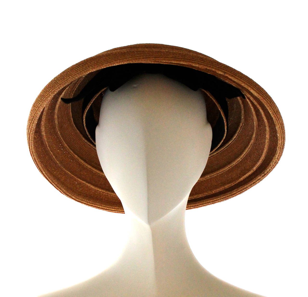 Christian Dior 1950's Fine Straw Saucer Shape Hat

No size
7 inch diameter inner brim
13 inch diameter outer brim

Grosgrain inner band and Velvet ribbon Bow

Excellent Condition