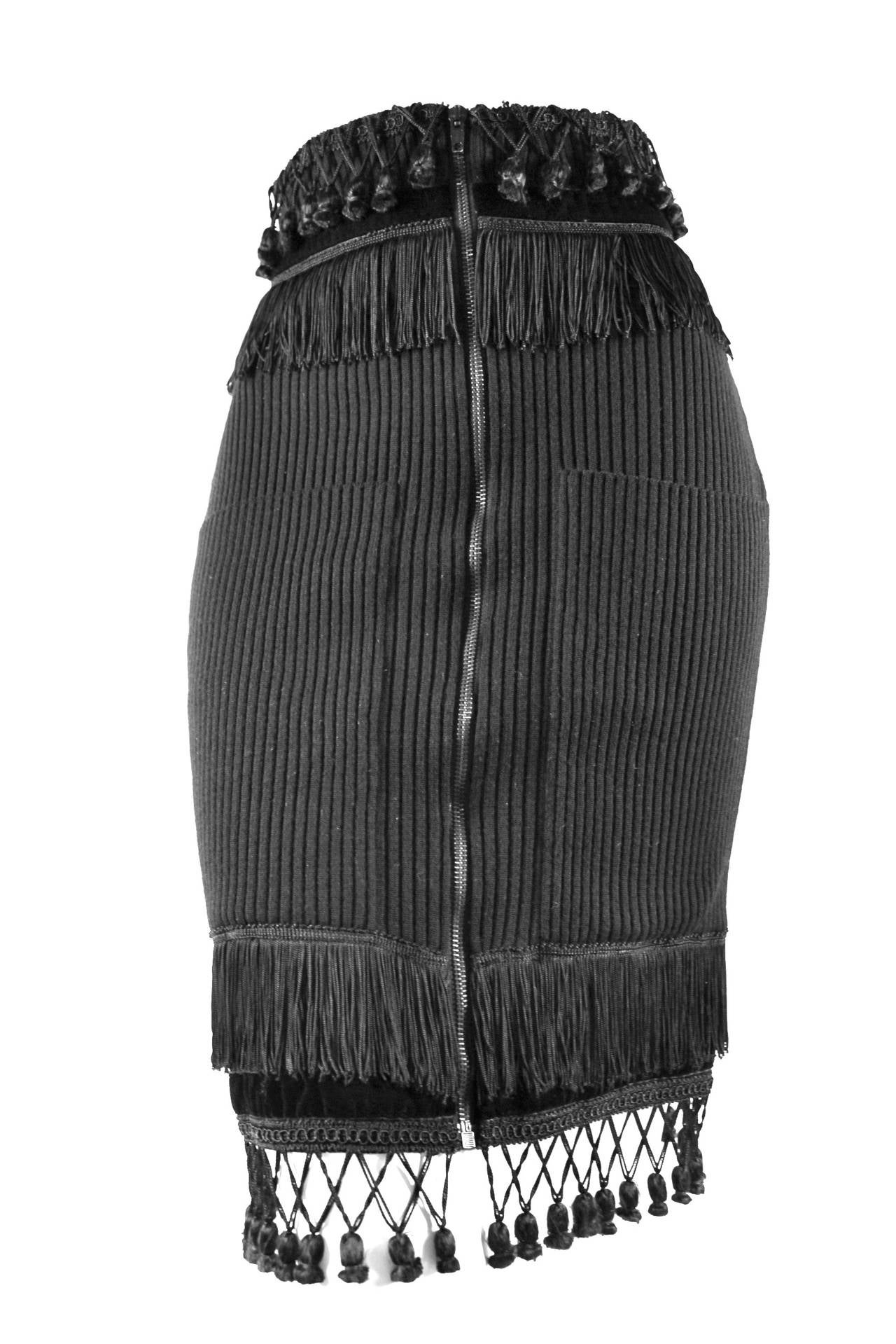 1980s Jean Paul Gaultier for Equator Skirt

Ribbed skirt with decorative fringe and tassels
Excellent condition 

Labelled size 40
Missing the Equator label but still contains Fuzzi label