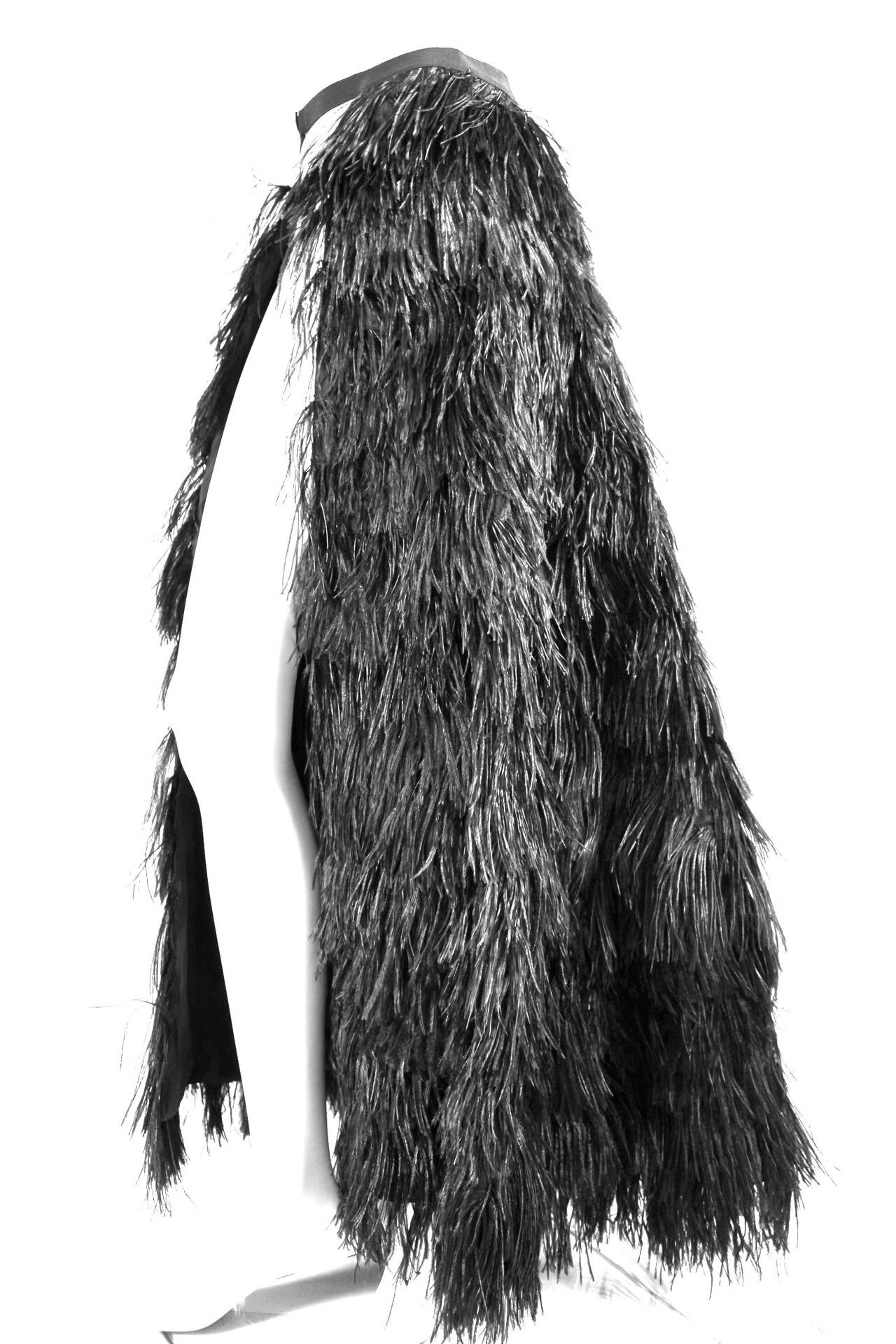 Givenchy Ostrich Feather Overskirt or Cape
Labelled size 38
Full length is 43 inches
Detachable segment on bottom with hook and eye closures means it can also be worn as 28 inch length skirt or cape.