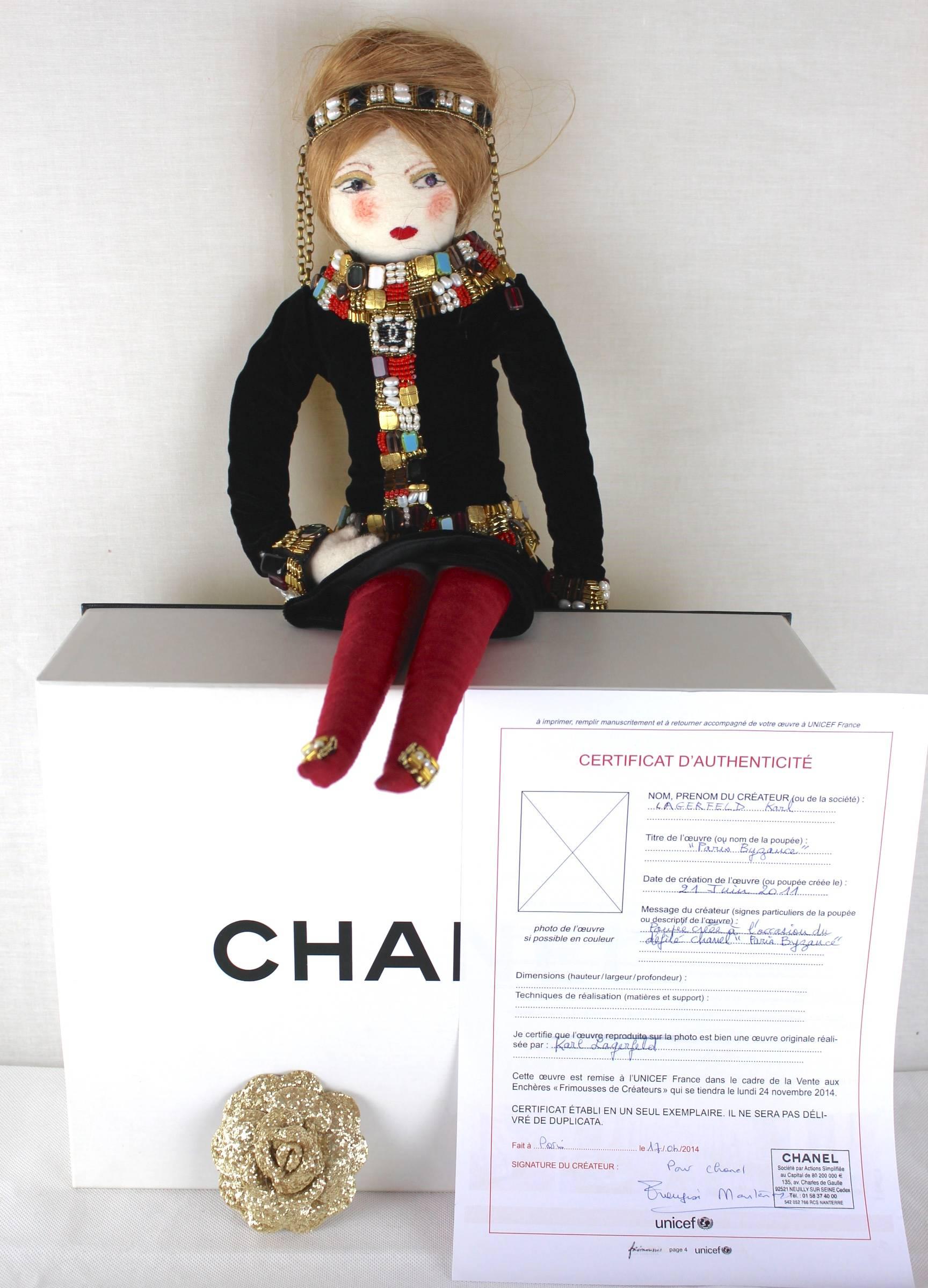 Chanel Byzance Paris Collectors Doll
Lesage Hand Beaded 
Semi Precious Stones and Natural Freshwater Pearls
Certificate of Authenticity 
Boxed and includes Chanel Silver Glitter Camellia 
An exceptional piece from Karl Lagerfeld-Chanel stands 2
