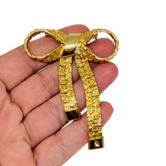 Vintage gold tone textured bow designer brooch