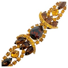 Superbe bracelet de créateur vintage avec des strass couleur or, ambre et citrine