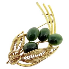 Vintage gold tone natural green jade cabochons flower brooch
