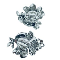 Vintage silver tone flower designer 1970s clip on earring