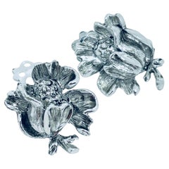 Vintage silver tone flower designer 1970s clip on earring