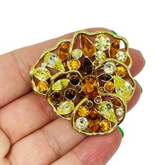 Spilla vintage firmata NOLAN MILLER con motivo floreale in strass color oro