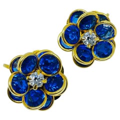AVON signed vintage gold tone sapphire crystals flower designer clip on earrings