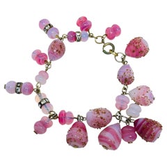 Vintage-Armband im Chin-Stil mit goldfarbenen, wunderschönen rosa Kunstglasperlen als Anhänger