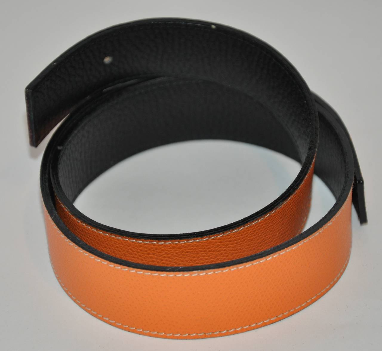 Hermes textured iconic tangerine with black interior calfskin belt for interchangable buckles measures 1 1/4