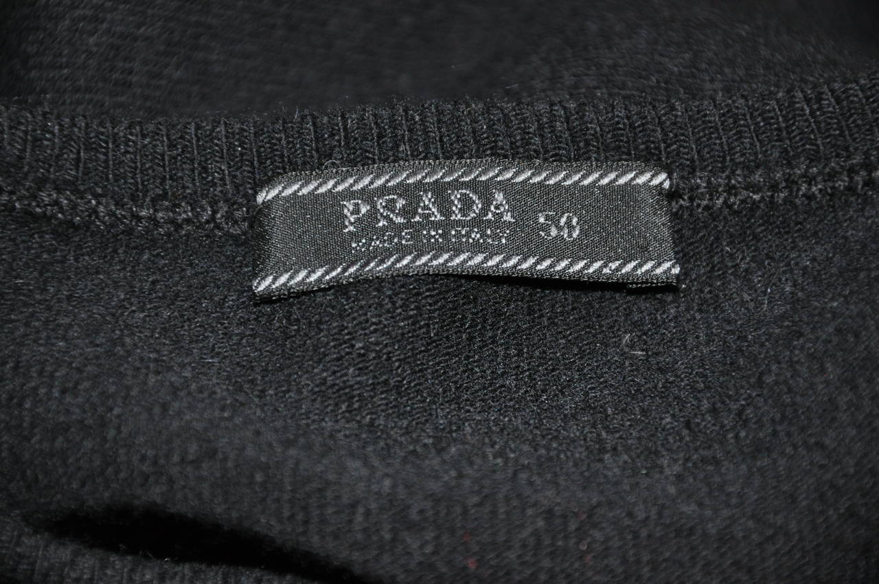 Prada men's black crew-neck pullover is size 50/Italy. The shoulder measures 18