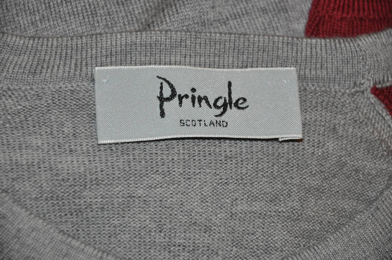 Pringle's men's gray & burgundy superfine merino wool crew-neck pullover is sized ex-large, made in Scotland. The shoulder measures 20 inches across, the front length is 23 inches, back is 27 inches, underarm circumference is 48 inches, sleeve