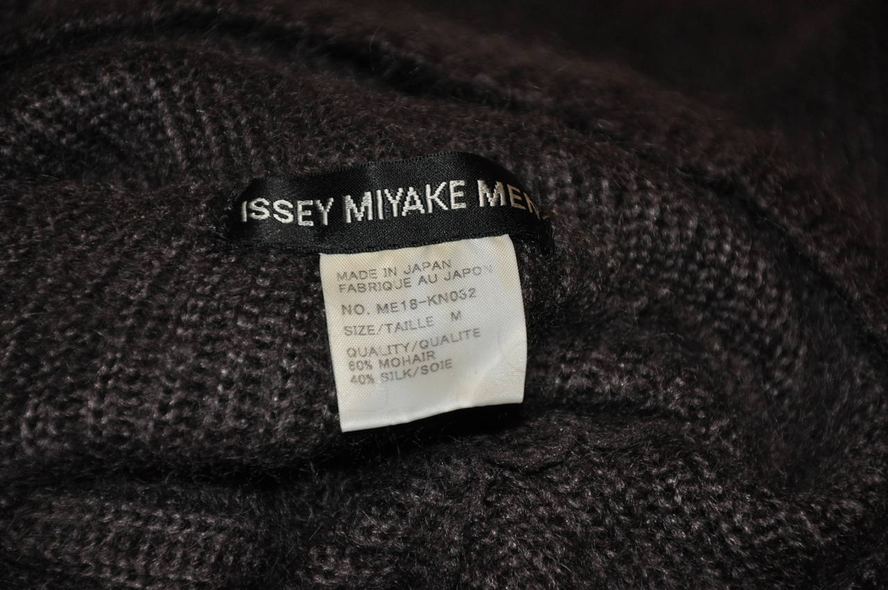 Issey Miyake men's pour homme coco-brown high-neck pullover is of 60% mohair, 40% silk.
   The shoulder measures 42
