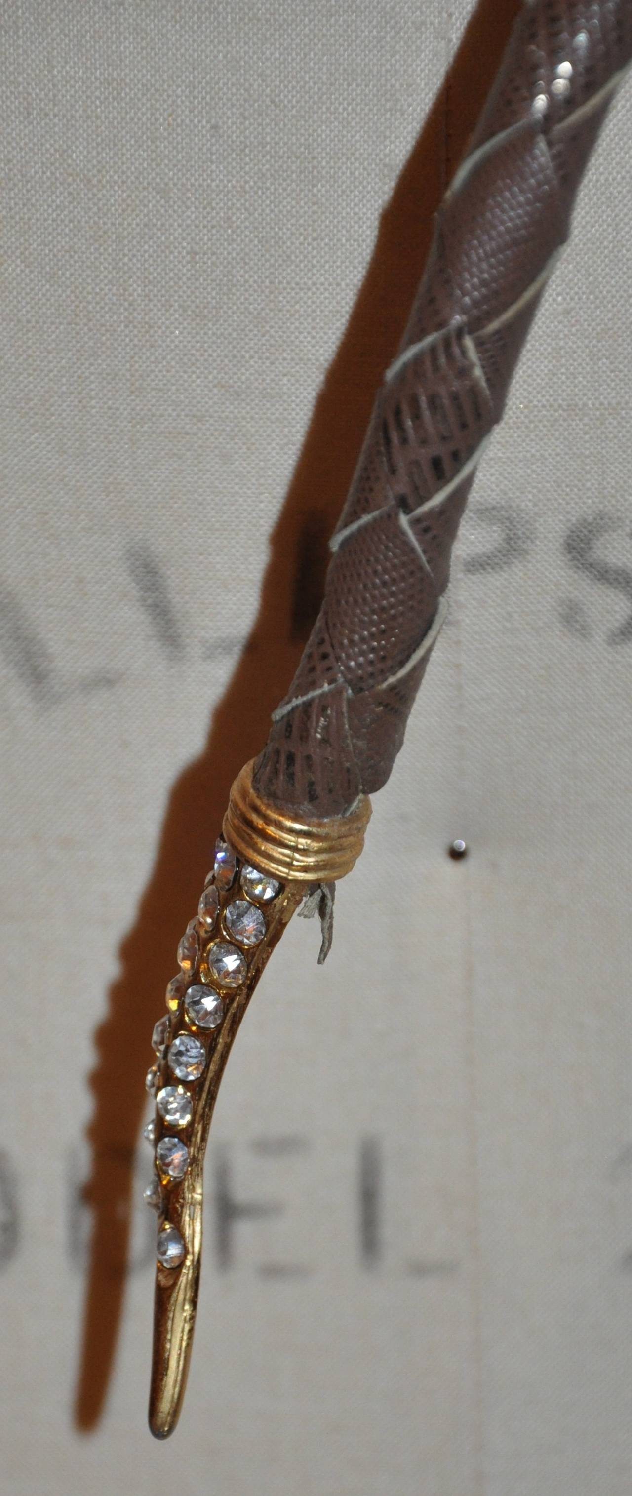 U. Correani rhinestone snake accented with woven leather belt measures 34
