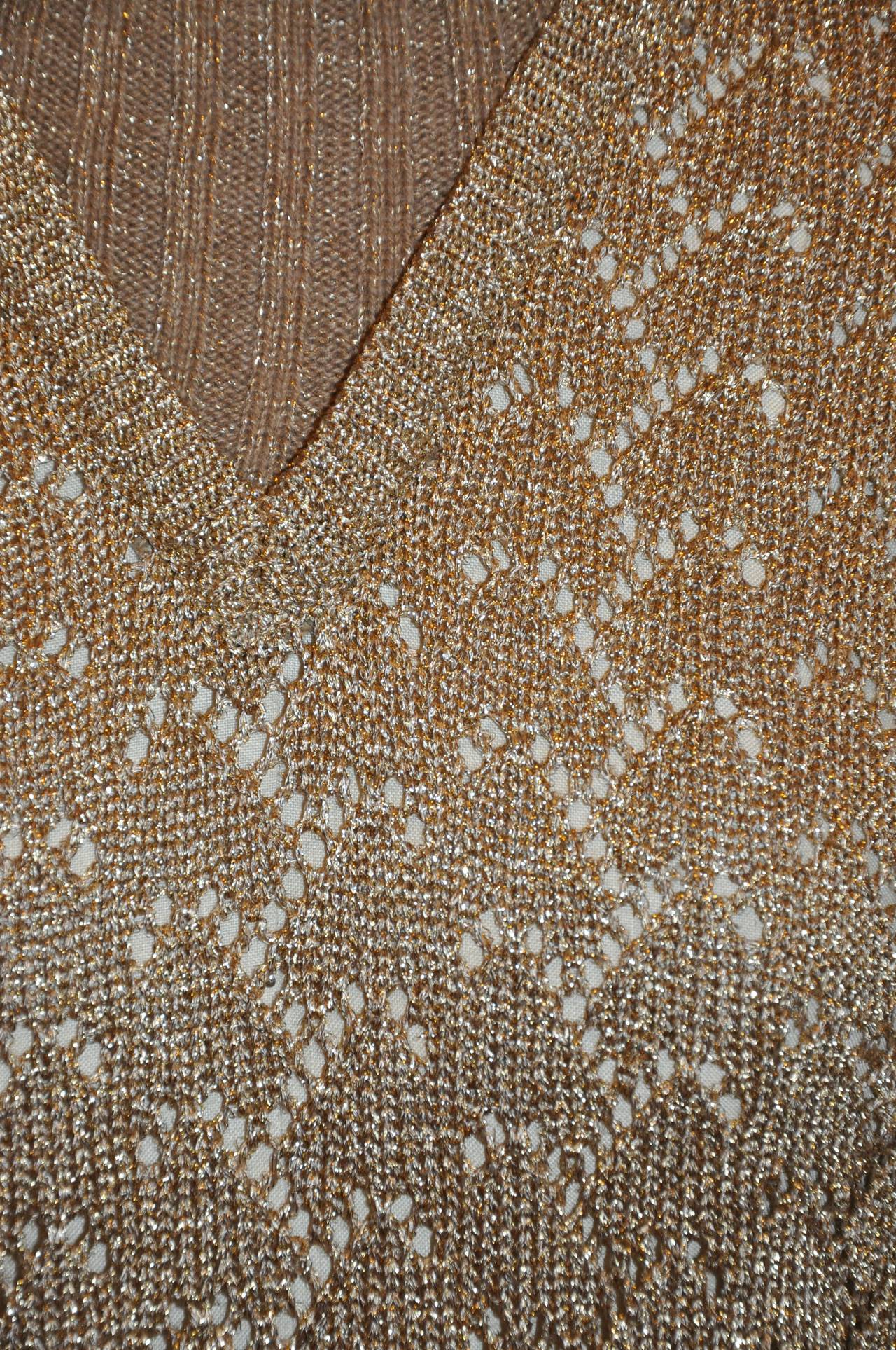 Moschino 'Couture' tan merino wool woven with metallic gold lame and accented with woven gold lame in both front and back. Turtle neck measures 5 1/2