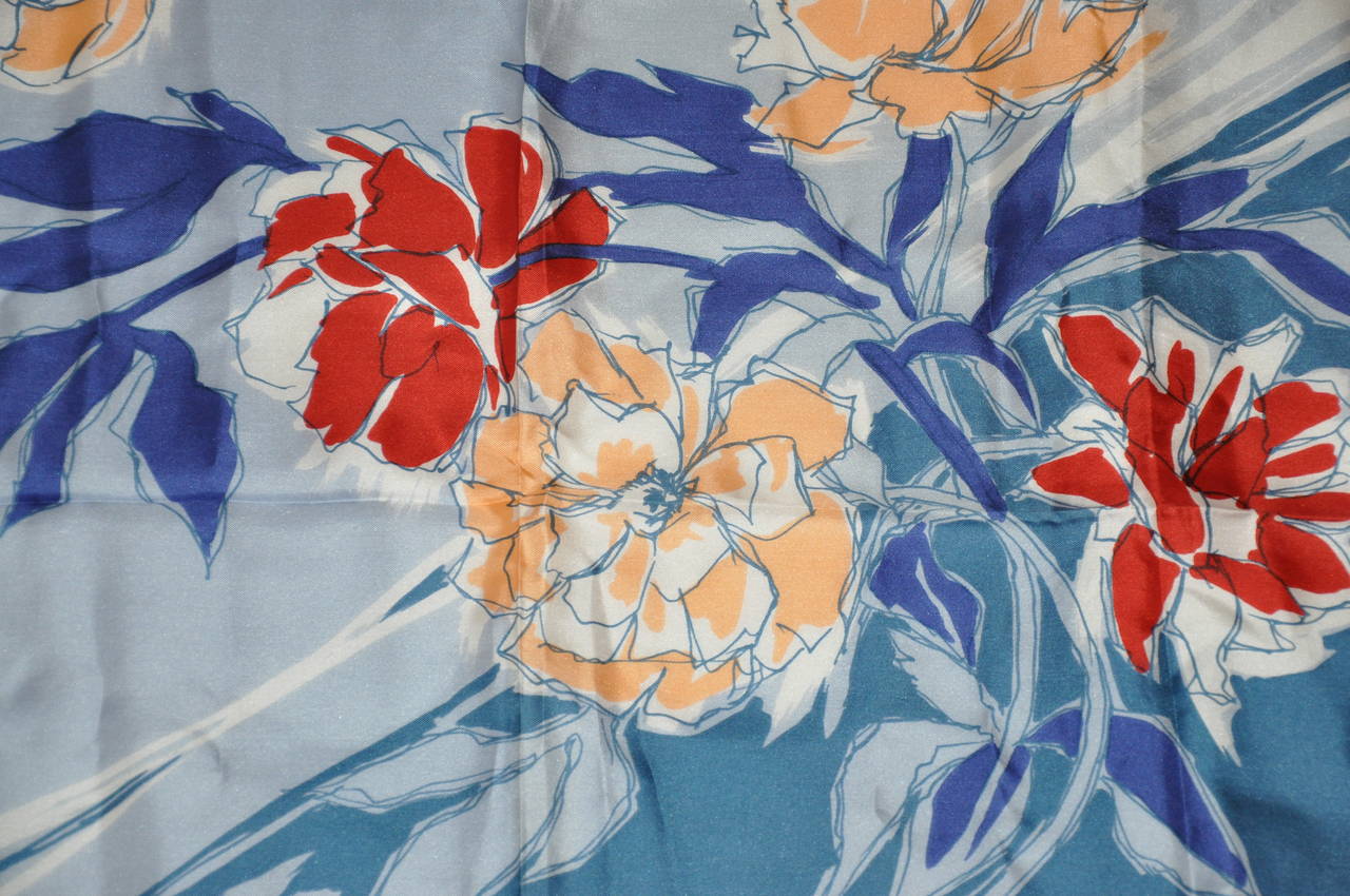 J. D'Ormont of Paris bold floral silk scarf is finished with hand-rolled edges. The scarf measures 30