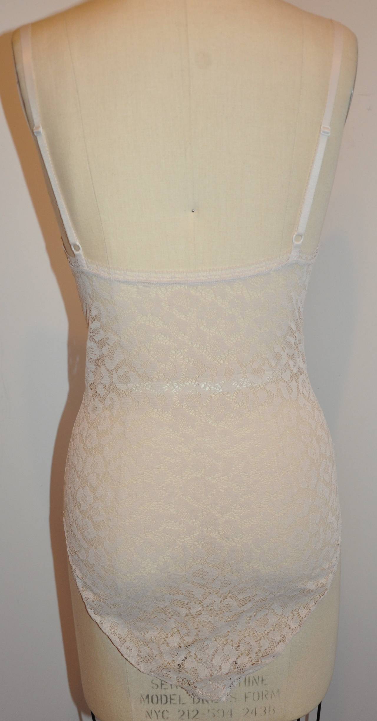 ERES ivory floral lace bodysuit is size 40/French. The bodysuit has three optional hook-&-eye at the crotch to adjust if desired for a better fit.