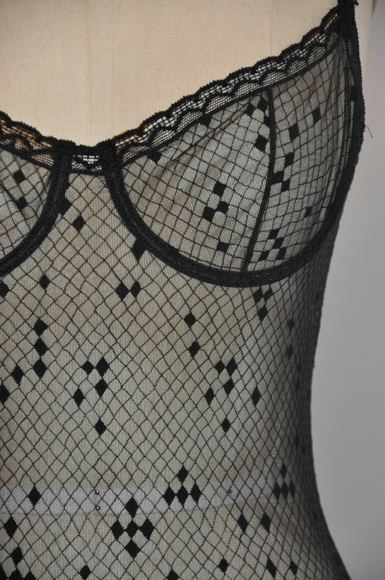 ERES black lace bodysuit has under-wired cups. Bodysuit is size 42/French. There are three optional hook-n-eye at the crotch for adjustment for a better fit if desired.