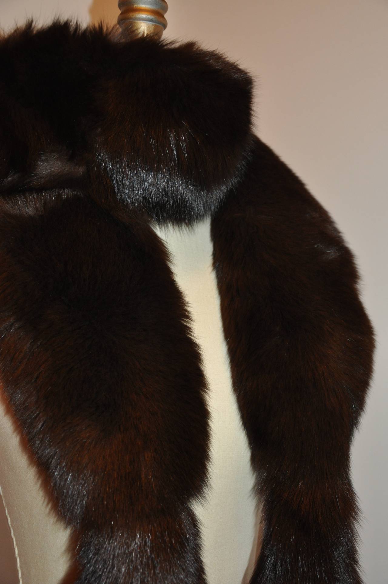 This wonderfully wicked and elegant warm coco-brown female skin fox scarf is accented with full fox tails on both ends of this wonderful scarf 
    The width measures 6
