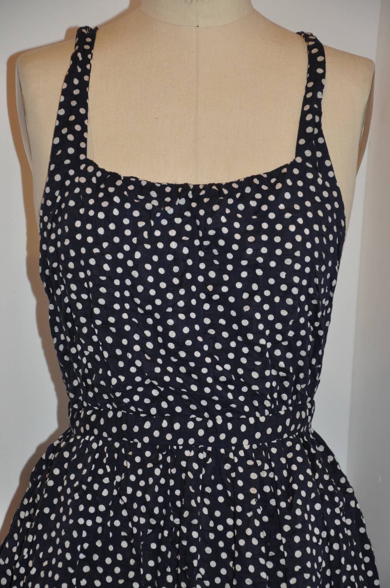 Halston's wonderful navy & white polka-dot sheersucker maxi dress is simply perfect for those hot summer days and nights.
   The waist measures 25