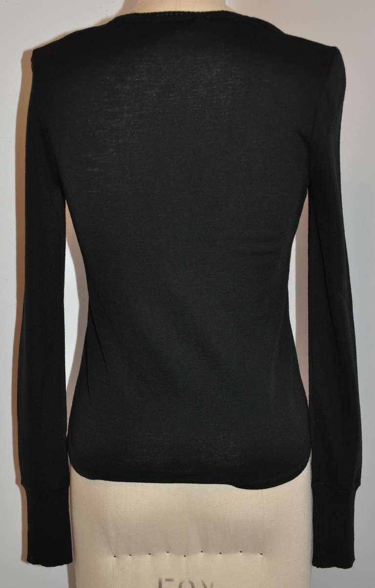 This wonderful Balenciaga black top is accented with a woven 