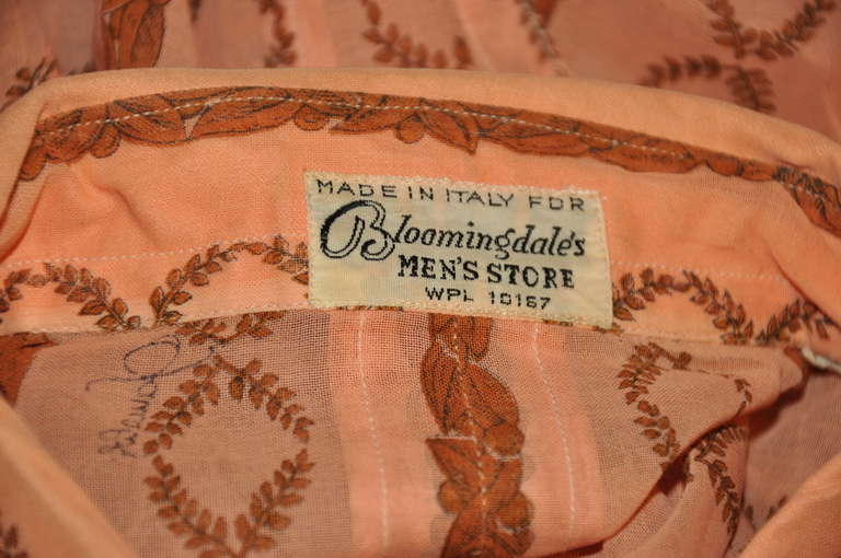 This wonderful greek-inspired print men's shirt made of fine Switzerland cotton  is in a rich coral shade with warm brown print. The front is accented with 