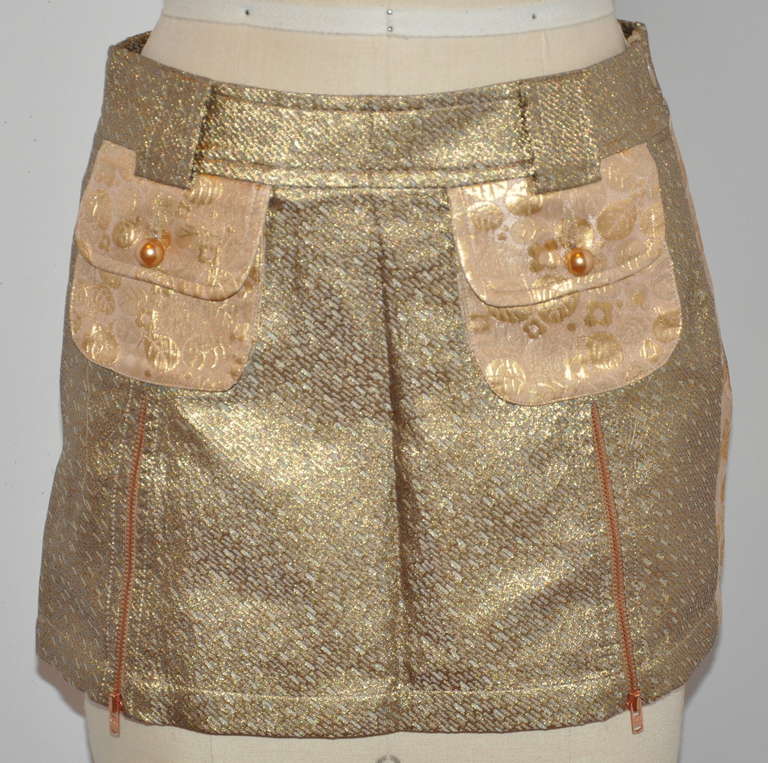Custo's wonderful multi-print brocade gold lame skirt features an optional double zipper front which can be worned closed or opened showing multi-print gold lame within. The front zippers of gold hardware measures 6
