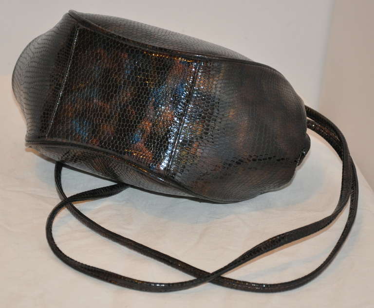 Albert Nipon multi-shade embossed lizard shoulder bag has wonderful shades of bronzes, browns and blues to resemble some lizards when changing colors. The bag measures 6 1/2