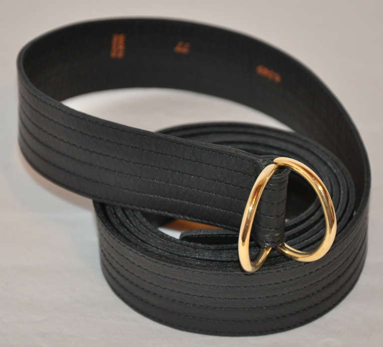 Yves Saint Laurent black detailed D-ring belt with detailed top stitching and finished with two(2) gold hardware 