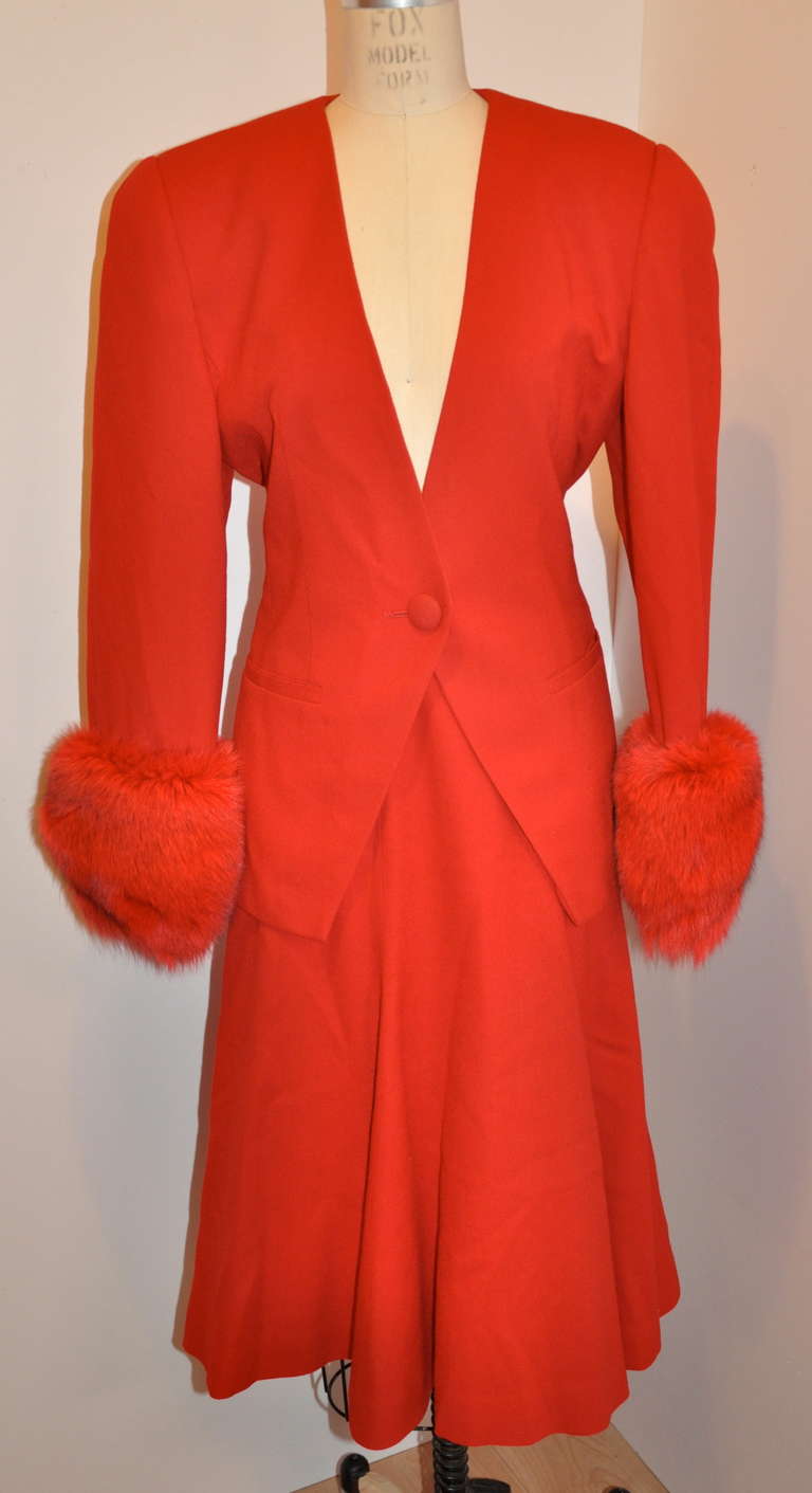 This wonderfully Albert Nipon Engine Red wool crepe ensemble of a jacket with matching skirt is simply perfect for the Holidays. Both items are fully lined in red silk. 
   The jacket has a single fron button covered with matching wool crepe, along