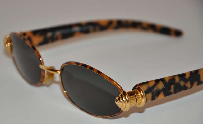 This wonderfully wicked Gianfranco Ferre sunglasses measures 5 1/2