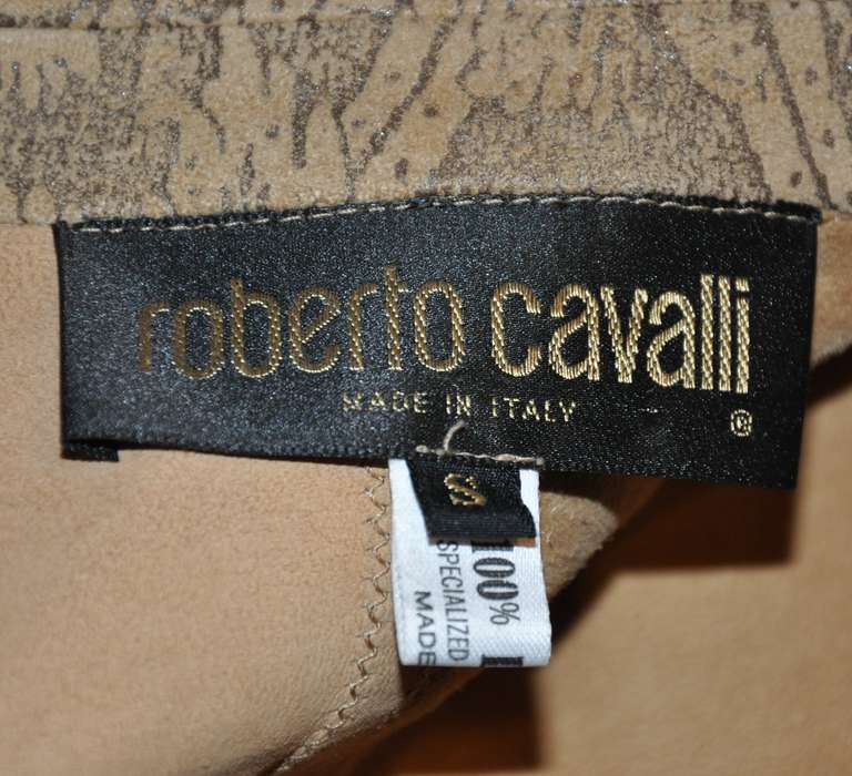 Roberto Cavalli embossed lambskin patchwork jacket is detailed with metallic bronze print, finished with lambskin piping along with detailed top-stitching along with lambskin ties.
   Front measures 28