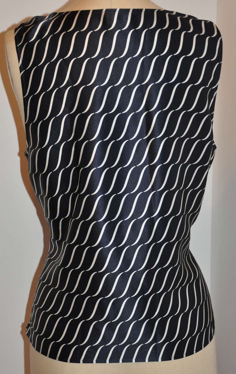 This wonderfully elegant Giorgio Armani silk navy & white draped bias-cut front top has an invisible side zipper which opens from the hem upward, and measures 12