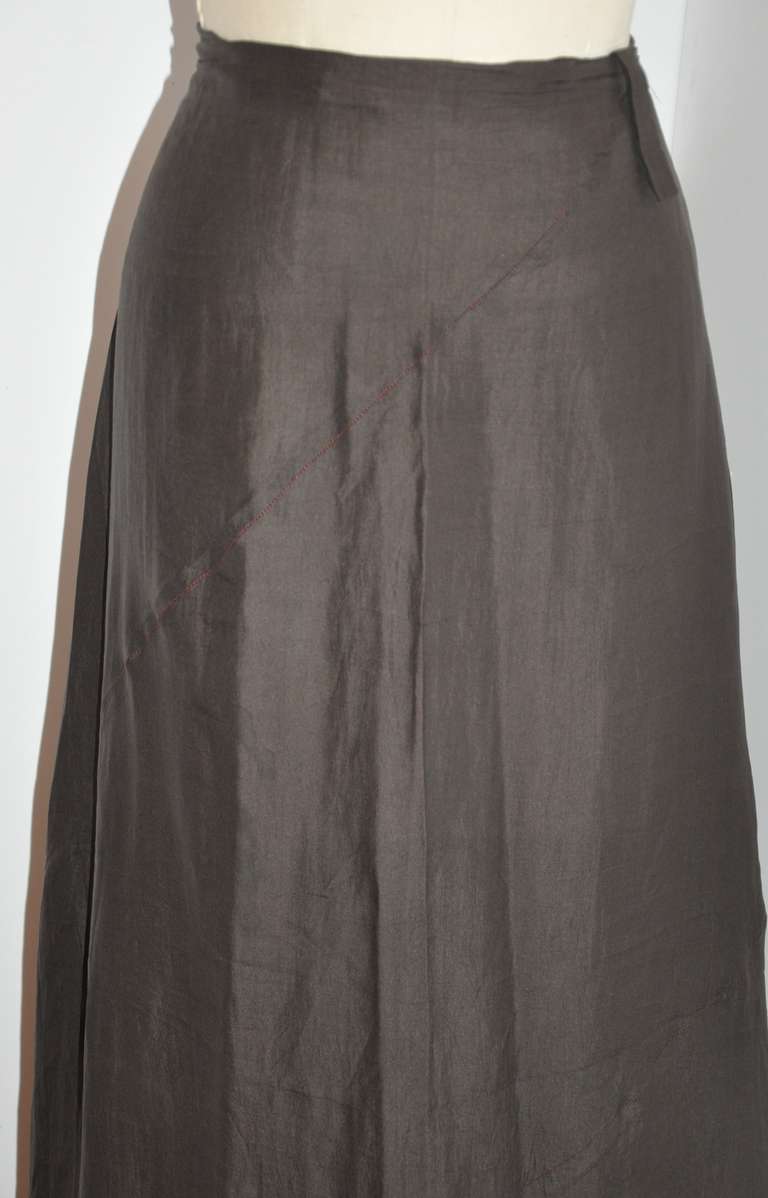 This wonderfully asymmetrical cut maxi skirt has a asymmetric invisible zipper measuring 10