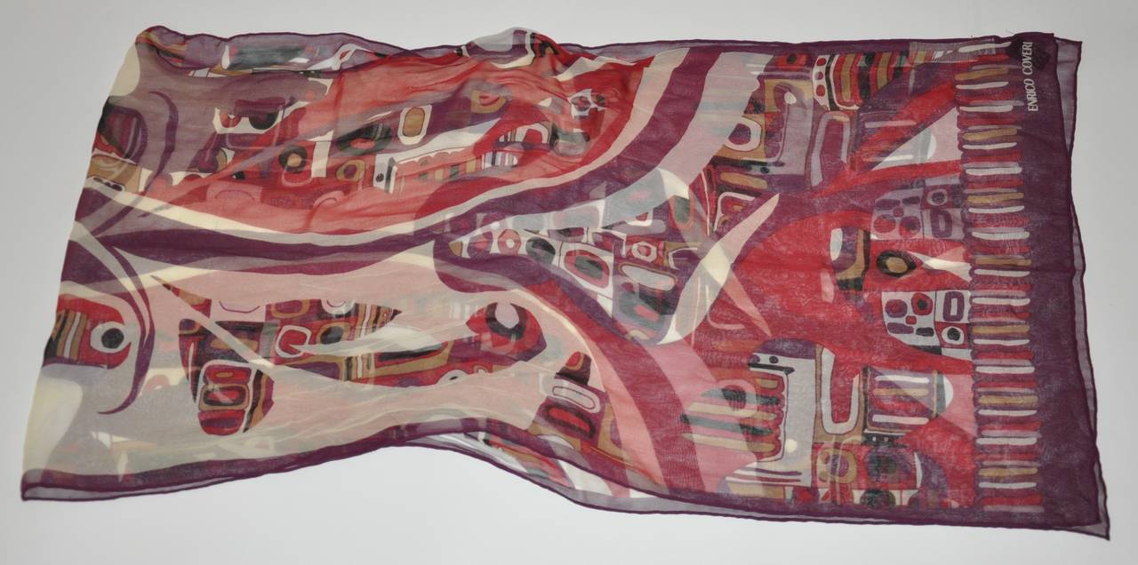 Enrico Coveri bold multi-color abstract print silk chiffon scarf is finished with hand-rolled edges and measures 62 1/2