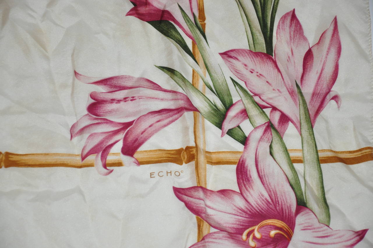 Echo's multi-color silk scarf with multi-floral prints of Orchids is finished with rolled edges and measures 34