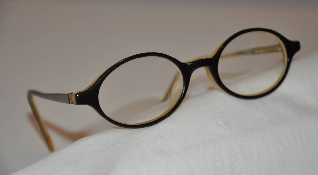 Sagami of Japan black accented with golden yellow interior lucite eyeglasses measures 5 1/8