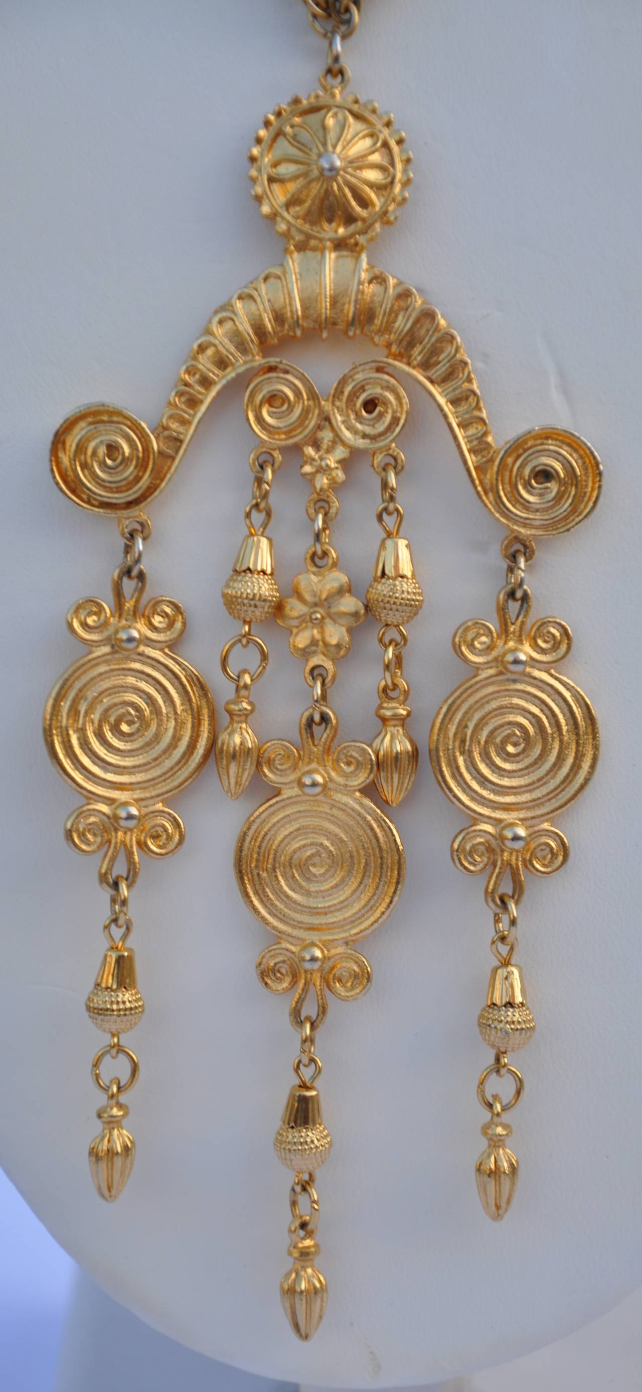 Vendome's wonderfully wicked gold hardware necklace is combined with a huge mobile pendant. This wonderful piece is signed twice, one on the back of the pendant and also on the hook-clasp of the necklace. The necklace measures 19" in length.