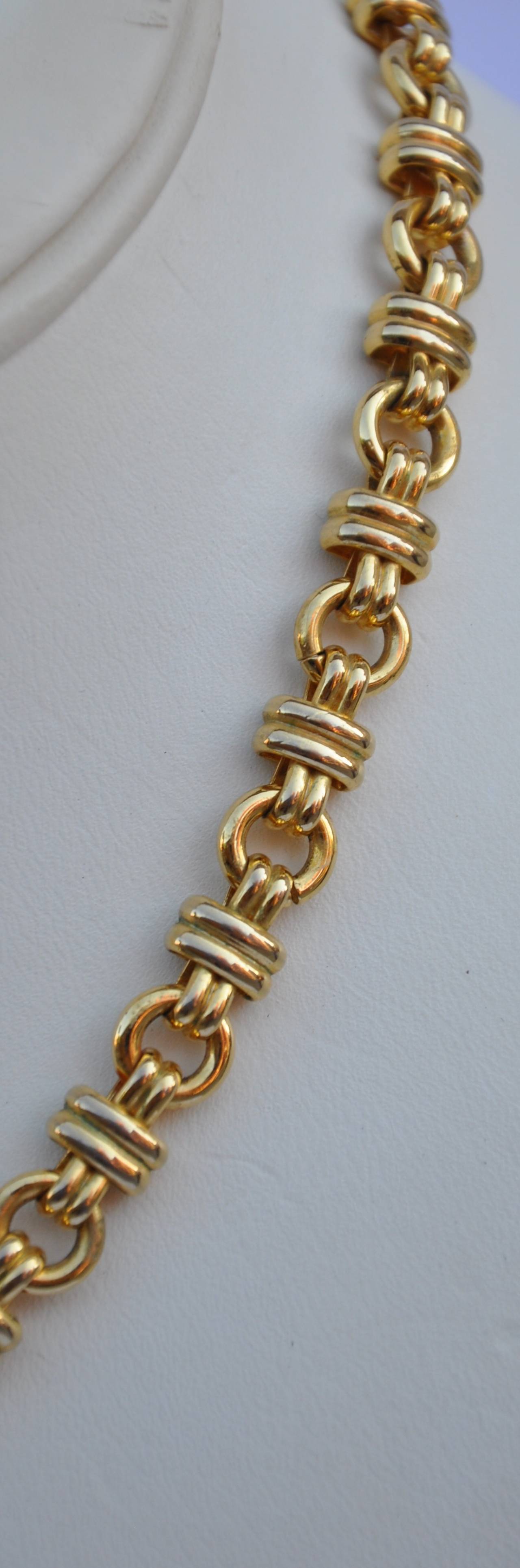 Elegant gilded gold hardware with vermeil-finish necklace measures 17", width is 5/16 and depth is 2/16"