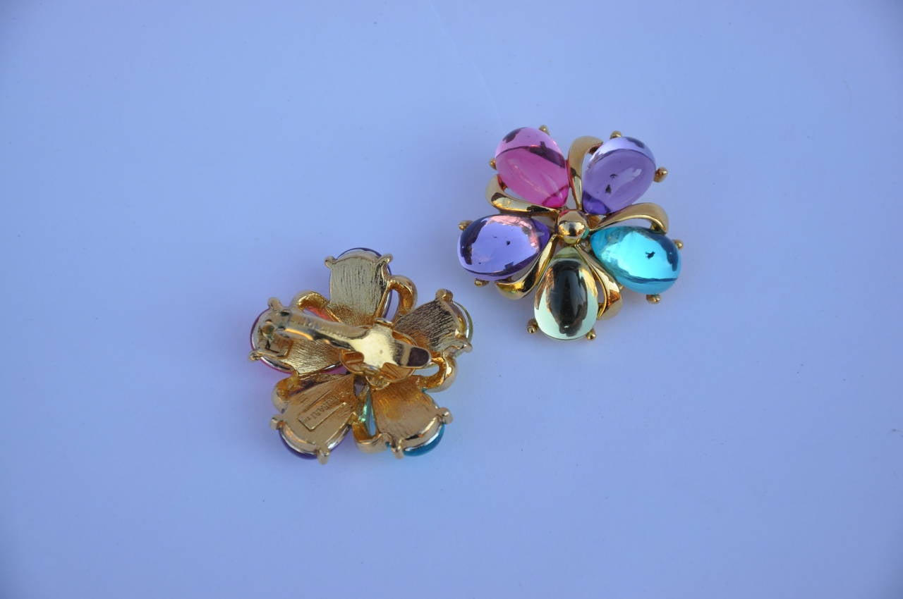 Trifari multi-color floral style ear clips with gold hardware measures 1 1/8" in circumference and 3/8" in depth.