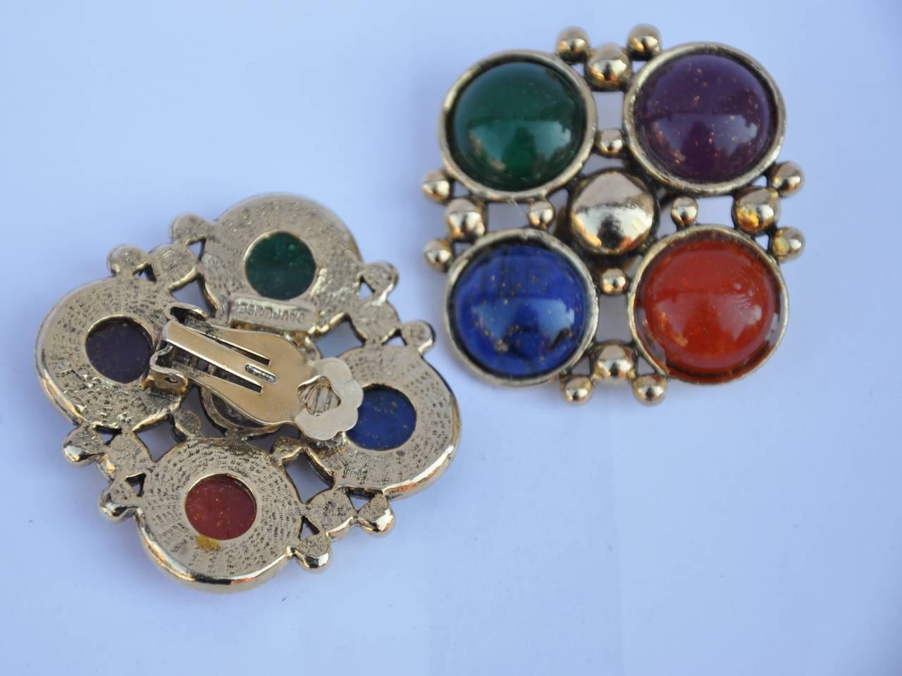 DauPlaise large gilded gold hardware is accented with multi-colors of resin stones on these 80's ear clips.