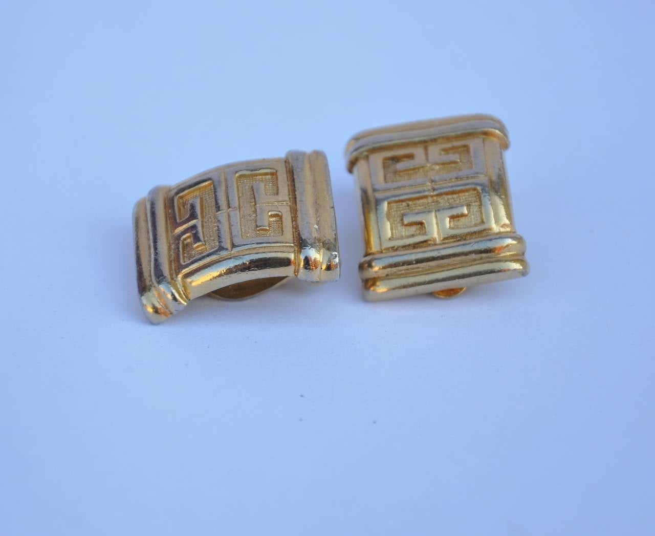Givenchy signature gold vermeil ear clips with his signature logo measures 1" in height, 1/2" in width and 2/8" in depth. Earrings are signed.