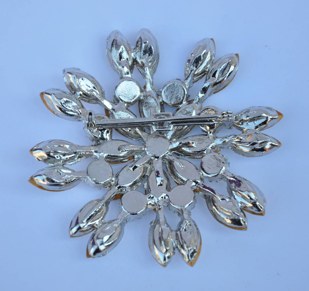 This wonderful huge magnificent multi-facade "Starburst" rhinestone brooch measures 2 3/4" in circumference and 3/8" in depth. This brooch is simply wonderful!