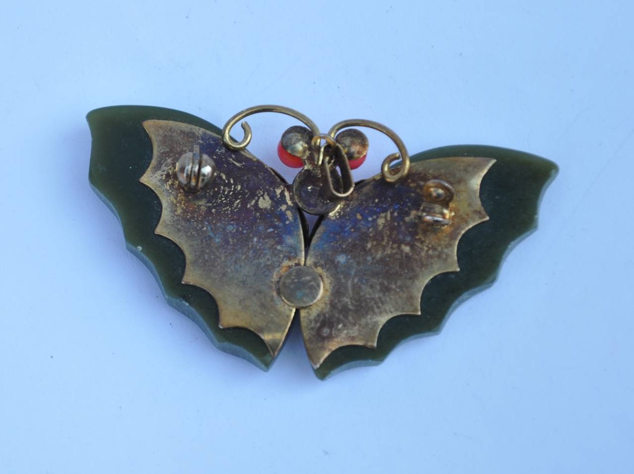 This wonderful Jadeite with coral gold-plated "Butterfly" brooch measures 1 1/8" in length, width is 1 5/8", depth is 2/8".