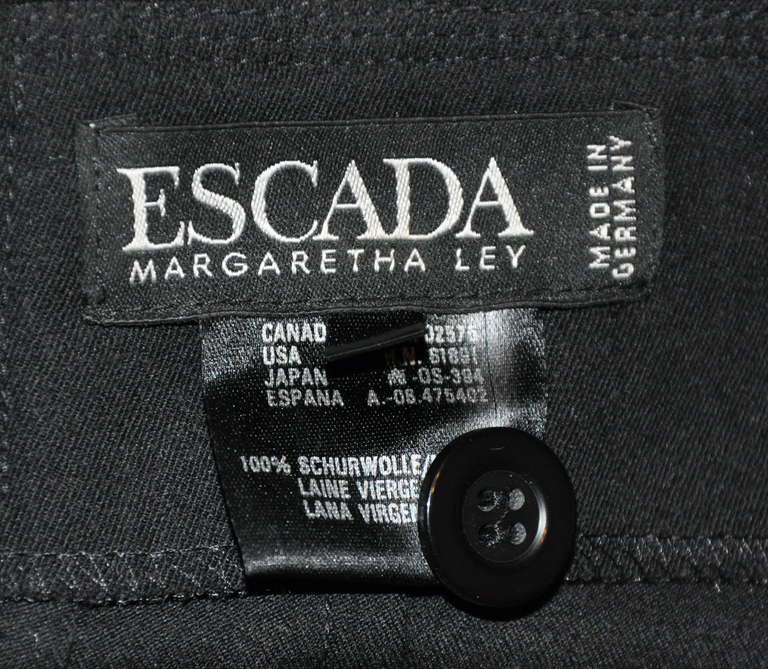 These wonderfully detailed top-stitched wool trousers from Escada by Margaietha Ley has two side set-in pockets and are semi-lined. The front zipper measures 8