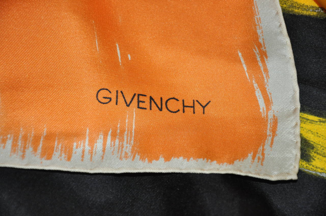 Givenchy's bold multi-color abstract print silk scarf measures 30