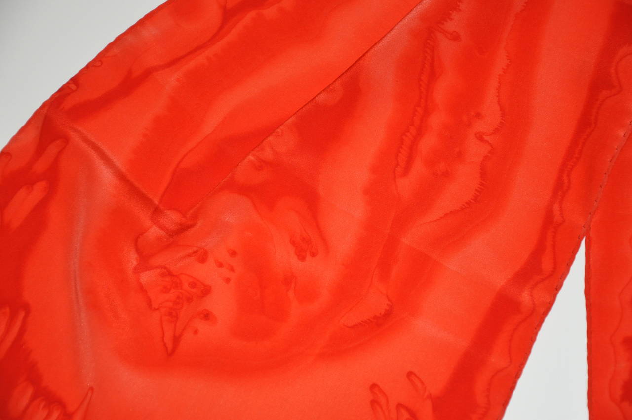 This wonderful hand-dyed silk scarf in multi-shades of reds measures 13