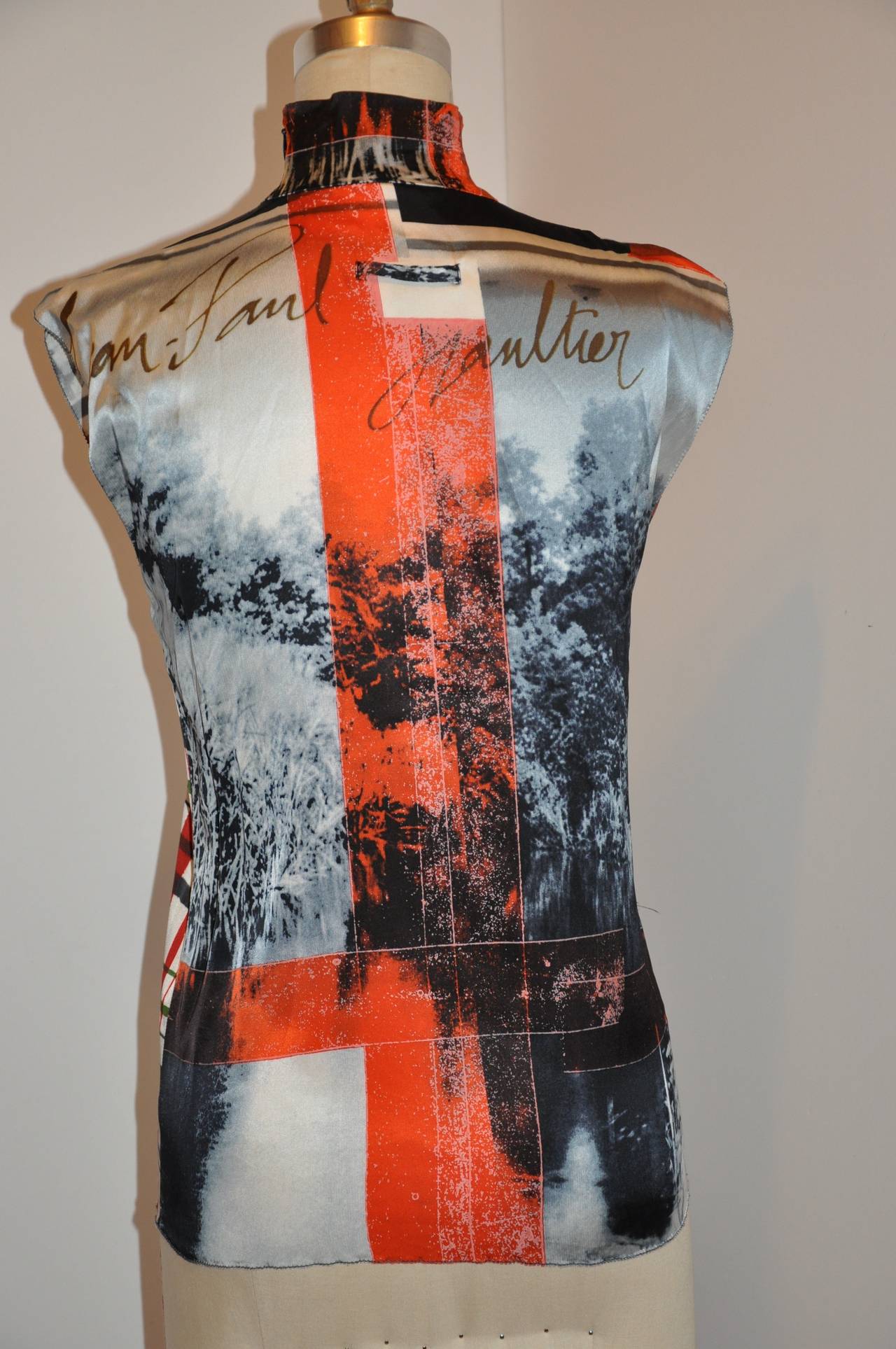Jean Paul Gaultier bold multi-color high-neck abstract stretch top has a hidden invisible zipper which measures 7