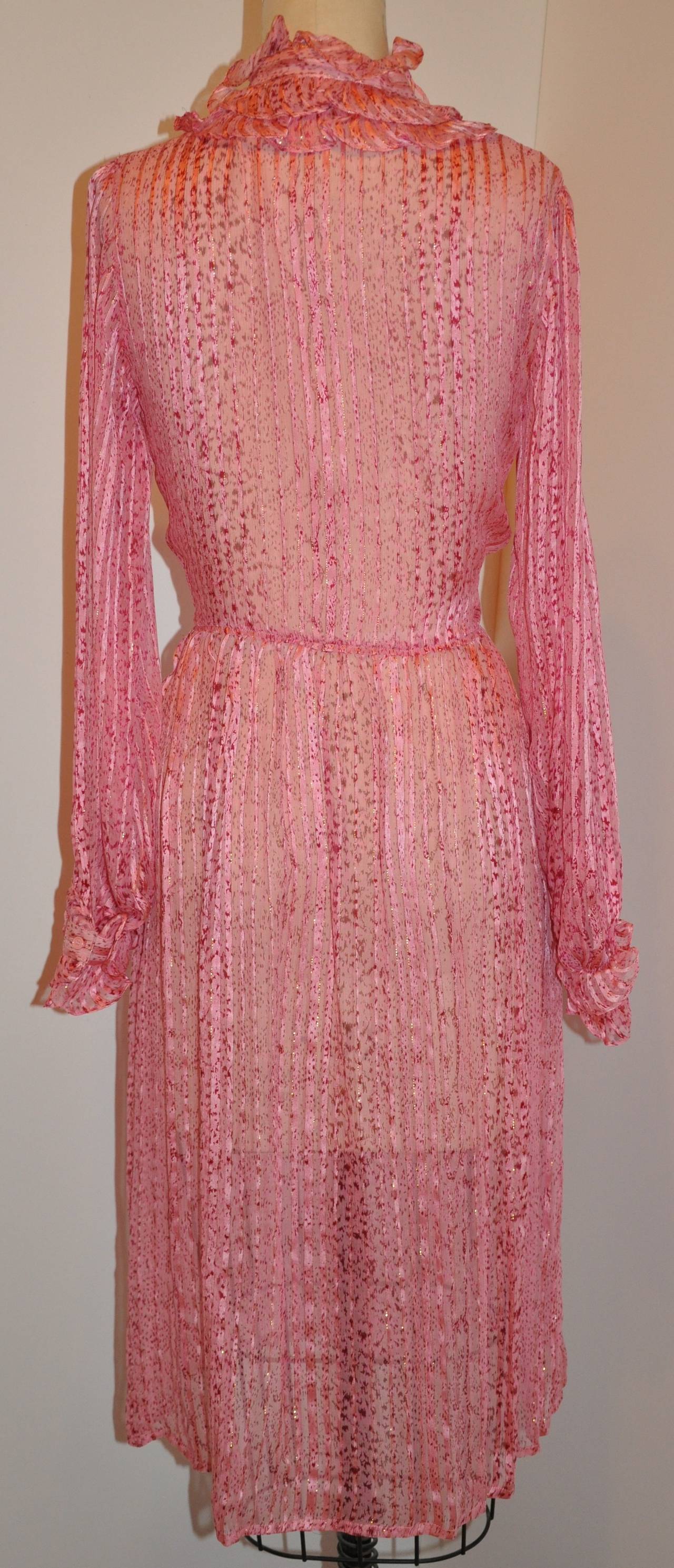 Saks Fifth Avenue shades of rose, red and pink silk with silk chiffon stripe ruffle dress has a center-front slit on the front which measures 8