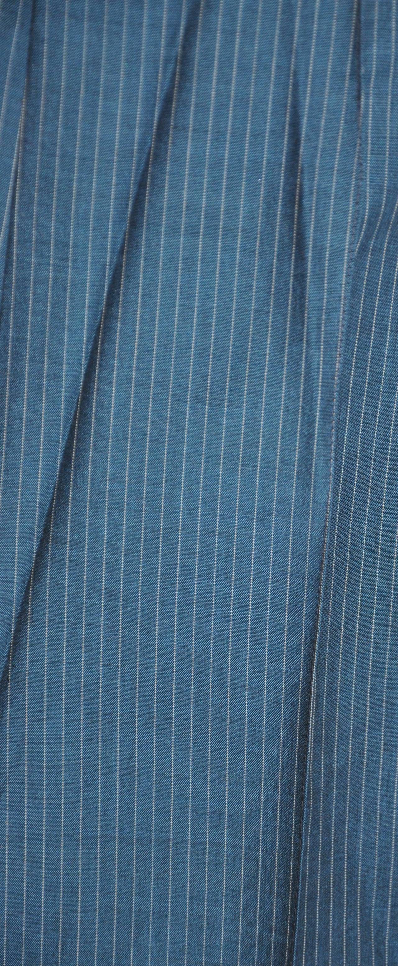 Romeo Gigli's wonderfully wicked blue pinstripe silk trousers measures 26