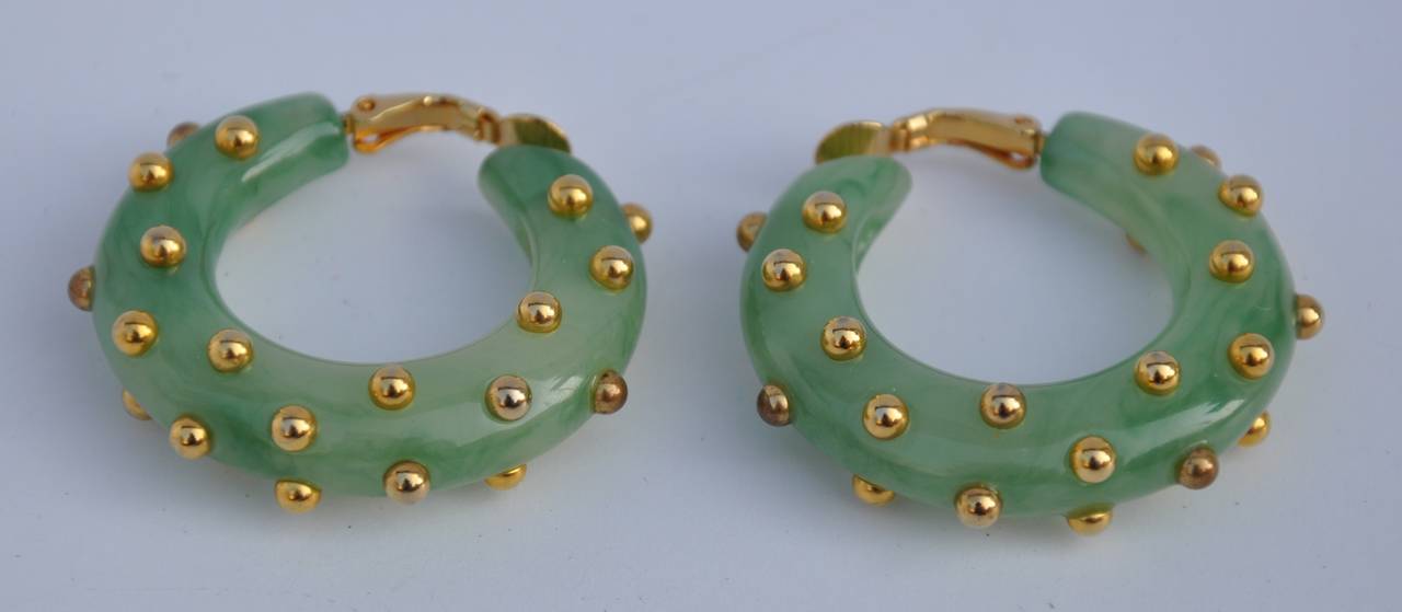 These wonderfully detailed green lucite accented with micro gold studs loop ear clips measures 1 1/2" in circumference, depth is 7/16".